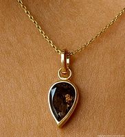 Pendant on chain showing overall size and color