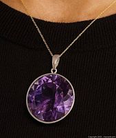 Pendant worn on model to show scale