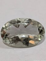 Front view of oval green amethyst gemstone