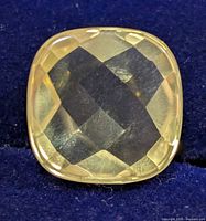 Front view of cushion-cut lemon quartz showing pale yellow color and faceting