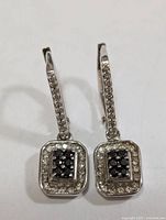 Front view of both sterling silver diamond earrings
