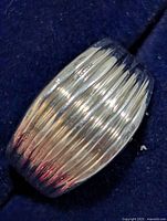 Top view of silver ribbed band ring