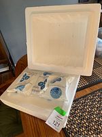 Styrofoam cooler open with two CS gel ice packs inside