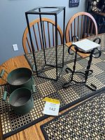 All items grouped on table: tall stand, short stand, two green pots