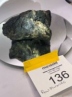 Whole rock on mirror showing size and reflective surfaces