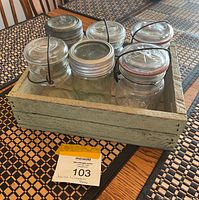 Crate with six jars overview