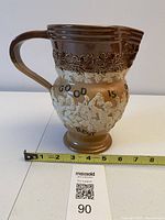 Full side view showing decoration and size reference