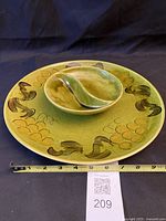 Platter and dip bowl front view with tape measure for scale