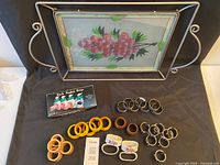 All items grouped: tray, assorted napkin rings