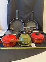 Group shot displaying all cookware pieces for scale