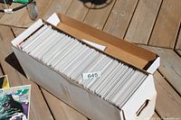 Top view of long comic storage box filled with bagged comics