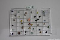 front view of acrylic display showing 36 marbles