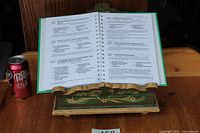 Stand displaying open cookbook to show function and size reference