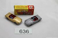 Overview of two cars and box with lot number