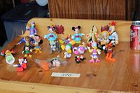 Full view of figurine collection arranged on wooden tray