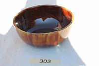 Angled view of full ceramic bowl showing glaze and form