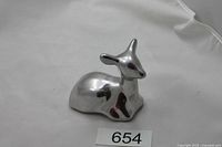 Left side view of polished aluminum deer figurine