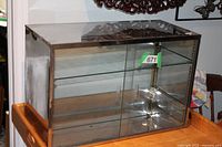 Front view showing glass sliding doors and adjustable shelf