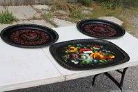 All three trays on table showing designs and sizes