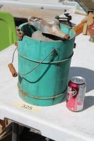 Front view of turquoise wooden bucket ice cream maker with crank and Dr Pepper can for scale