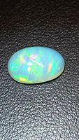 Front view of Ethiopian opal showing play of colour