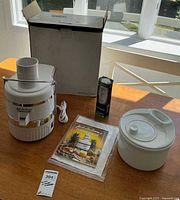 Group overview: juicer, ice cream maker, EveryDrop filter, booklet