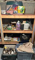 Full shelving unit with assorted paints, adhesives and tools