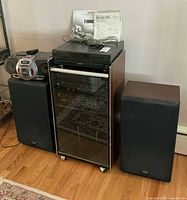 Front view of cabinet with Technics components and Kenwood speakers