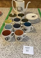 Full view of 19-piece Black Fruit service displayed on carpet