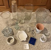 Overhead view of all glass and ceramic pieces arrayed on carpet