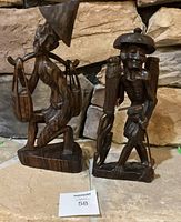 Front view of both wooden worker figurines