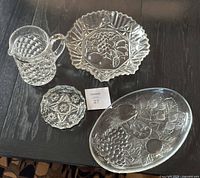 Group shot of all four pressed glass items