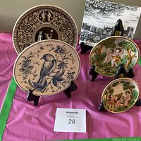 Front view of all four plates on stands