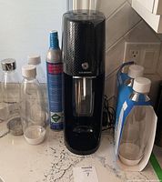 Front view of machine with cylinder and bottles