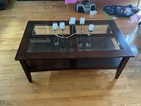 Front view of coffee table with candle holder on top