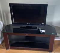 Front view of Sony Bravia TV on glass-top stand