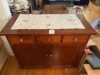 Front view showing full cabinet, drawers, doors closed