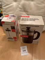 Two unopened boxes: Bodum Shin Bistro coffee maker and MarketSquare milk frother