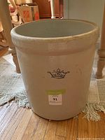 Front view of crock showing blue crown 6 mark