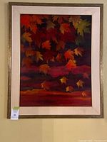 Full view of framed fall leaves painting