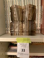 Front view of the pair of marble bookends on shelf