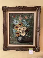 Framed oil painting of flowers, full view