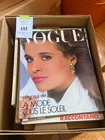 Box with visible Vogue Paris magazine