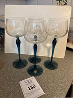 All four Orrefors wine glasses grouped to show quantity and overall condition