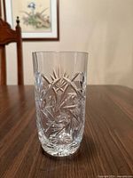 Single tall highball glass showing cut pattern and clarity