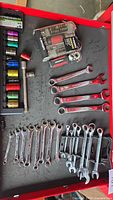Drawer view showing color-coded sockets, extension bar, ratcheting wrenches and combination wrenches