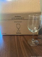 Box marked Madison Stemware and single glass