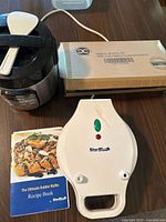 Bubble waffle maker, recipe book, Hamilton Beach multi-cooker, boxed spurtle set