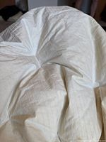 Close view of off-white down duvet insert fabric