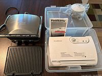 Cuisinart Griddler, FoodSaver sealer, manual, storage tote, round vacuum canister and plates